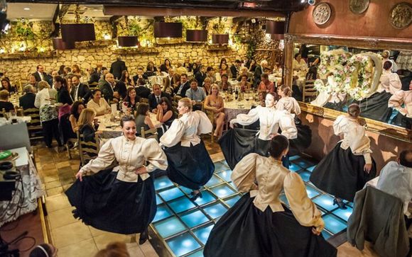 Evening at a traditional restaurant with a folklore show & dinner for stays of 9 nights or more 